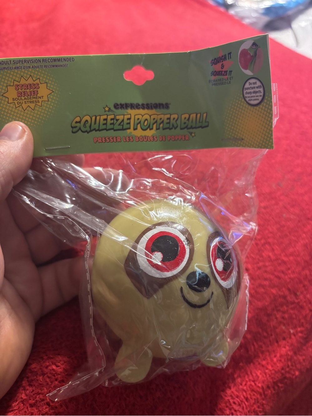 Expressions Tan Sloth  Squeeze Popper Ball with Smiling Face. New